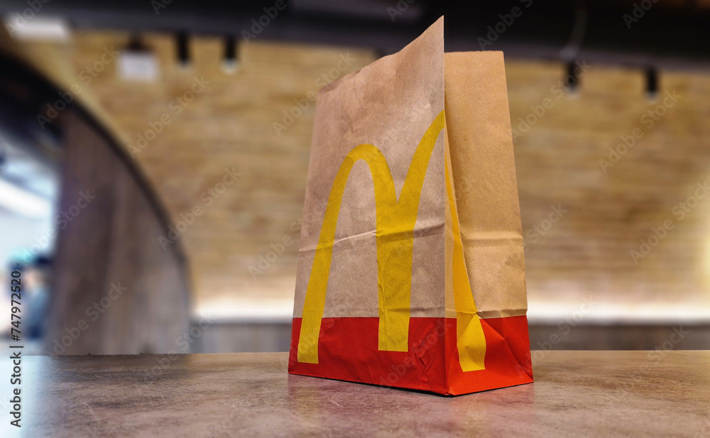 Kyiv, Ukraine - February 28, 2024: A paper bag with the McDonald's fast ...