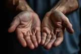 Man open hands as if holding something. Close up of male empty palms begging for help