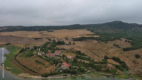 Nanclares de gamboa village in basque country, spain, with overcast skies and lush surroundings, aerial view photo