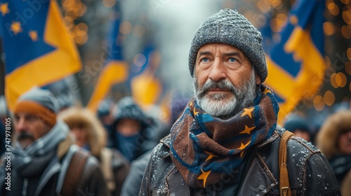 the senior man at the rally holding the European Union flag, symbolizing civic engagement and support for European values. Concept: Civic activism, European integration, political participation.