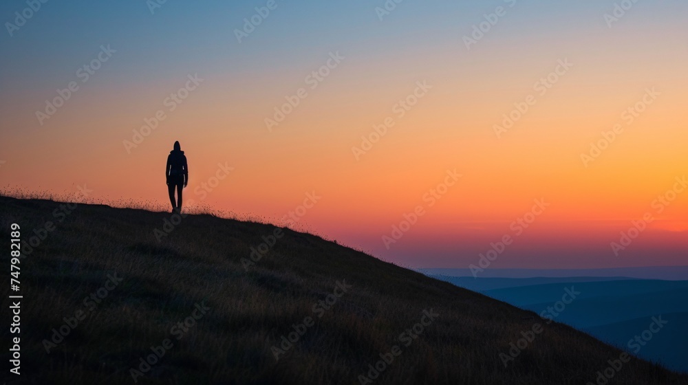 a person walking on a hill