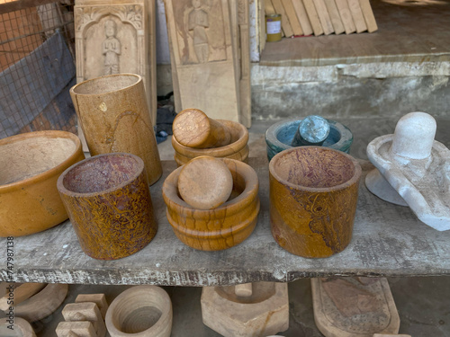 hamam dasta or mortar and pestle and cup made from jaisalmer yellow stone. It is specifically made with fossil habur stone. photo