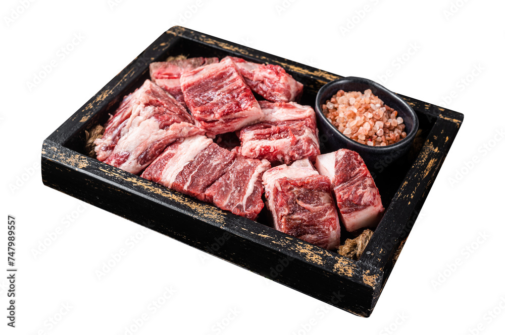 Uncooked Raw diced cubes of lamb meat in wooden tray with salt and thyme. Isolated, Transparent background.