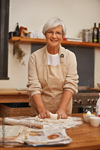 Senior woman, portrait and dough at home in kitchen for food, nutrition or dessert. Female person, elderly lady and retired cooking pastry dish on table, flour or recipe for eating, dining or dinner