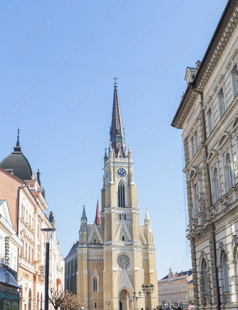 Roman Catholic church in Novi Sad, Serbia, blending neo-Gothic architecture with historical charm,  in the city center, inviting tourists to explore its cultural and religious significance .