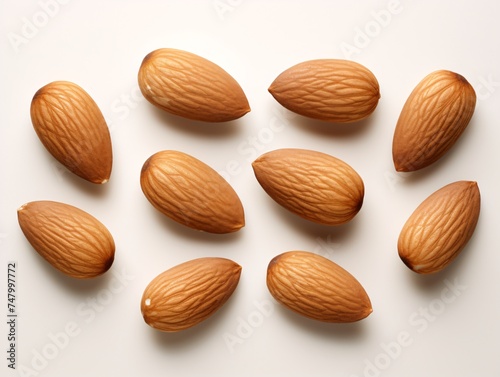 a group of almonds on a white surface