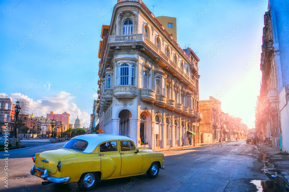 Yellow retro car on the ancient streets of Havana. Cuba. Coloring cubes. Vintage retro car