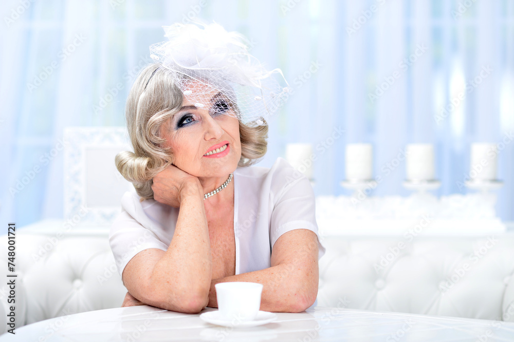 Portrait of a beautiful senior woman drinking coffee Portrait of a beautiful senior woman drinking coffee