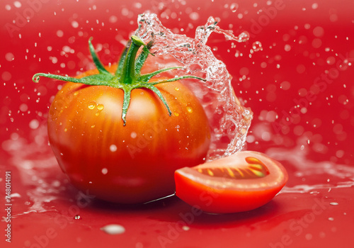 Tomato on Red background © musicphone1