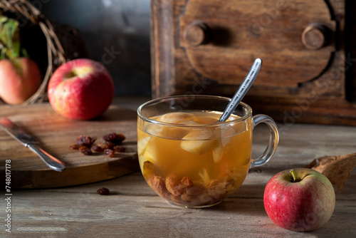 Apples and homemade compote on a rustic table