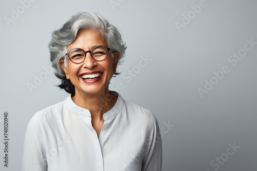 Portrait of a senior Indian ethnic woman with a cheering face