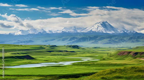 Majestic Azerbaijani Landscape: Panoramic View of Green Hills and Snow-capped Mountains