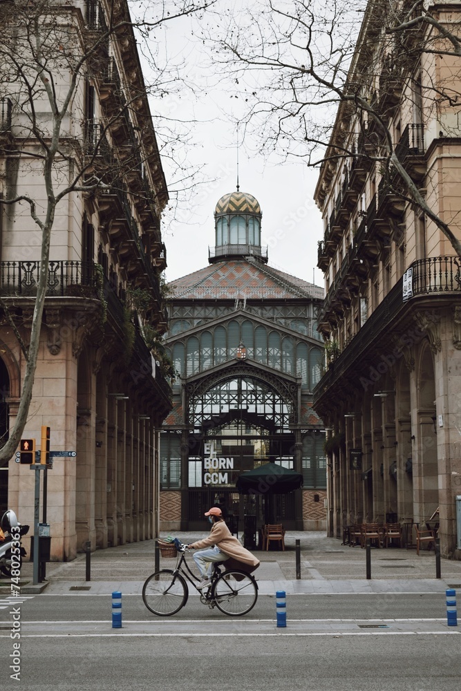 person riding a bicycle through Barcelona