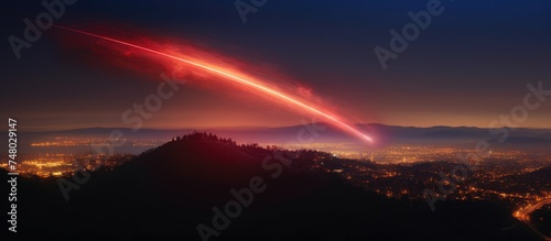 the speed of the missile s flash of light  on the hill  the night sky background  red  blue light Long