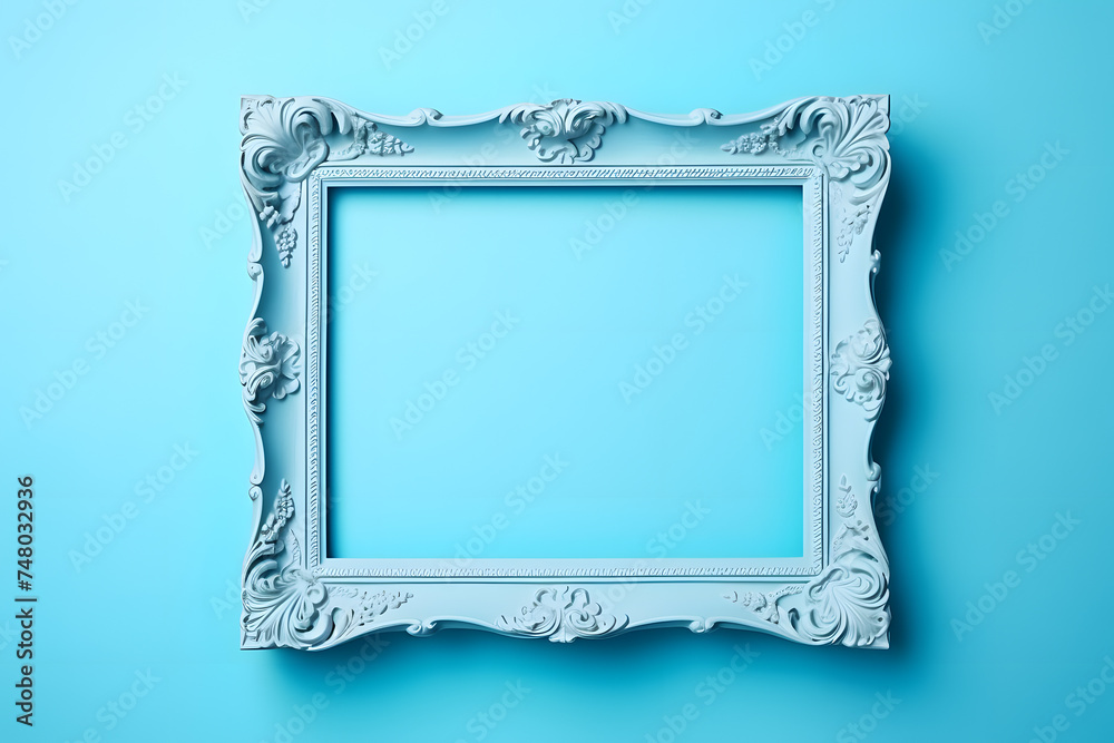 Top view of baroque style blue empty picture frame on pastel blue background Top view of baroque style blue empty picture frame on pastel blue background