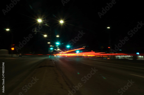 blurred car motion trails. Fast moving light effect, long exposure street night time photography in downtown area