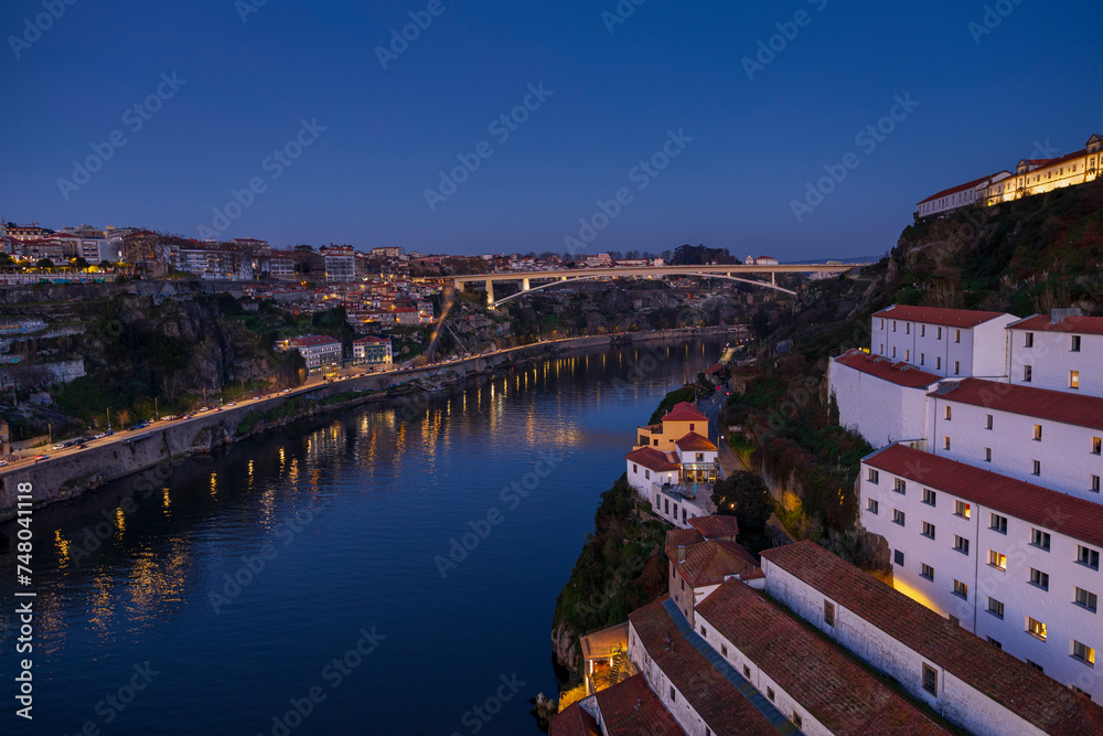 Panoramic view of Douro river and Infante D Henrique bridge at night, Porto, Portugal