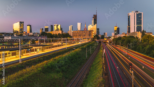 Warsaw, Poland - panorama of a city skyline at dusk with light trails. Cityscape view of Warsaw. Skyscrapers in Warsaw. Capital of Poland at night © Piotr