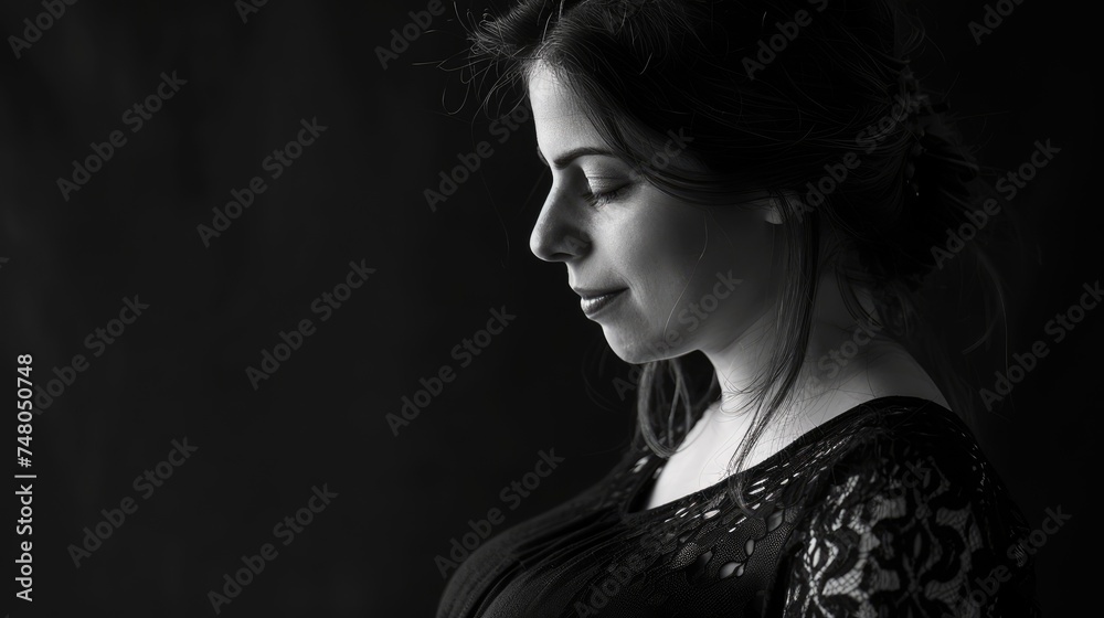 Artistic black and white portrait of a pregnant woman showcasing maternal beauty. Artistic black and white portrait of a pregnant woman showcasing maternal beauty.