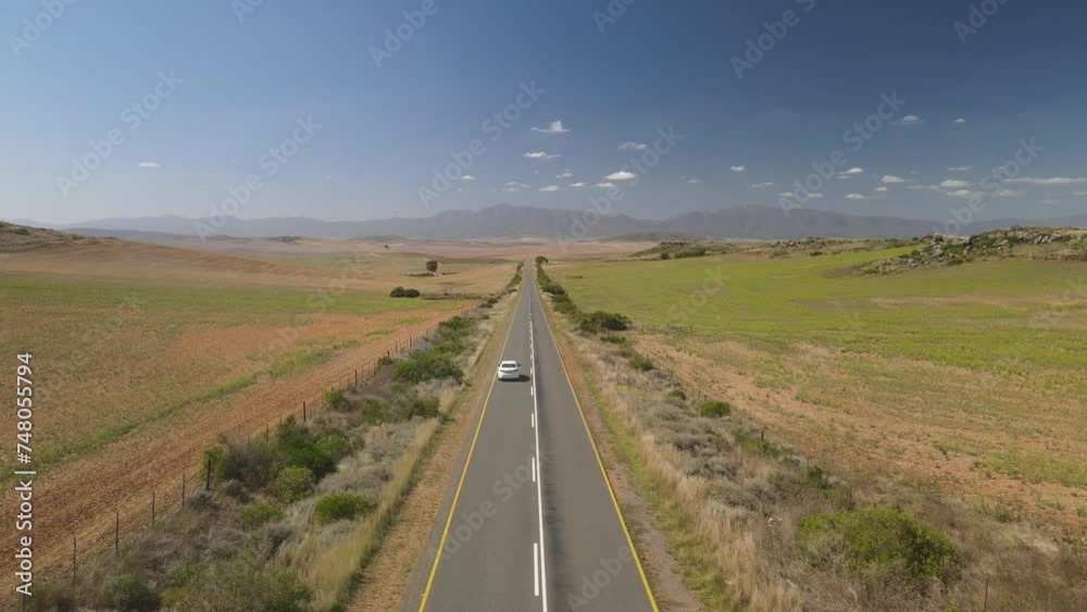 Fly over across South African straight desert road with blue sky background Fly over across South African straight desert road with blue sky background