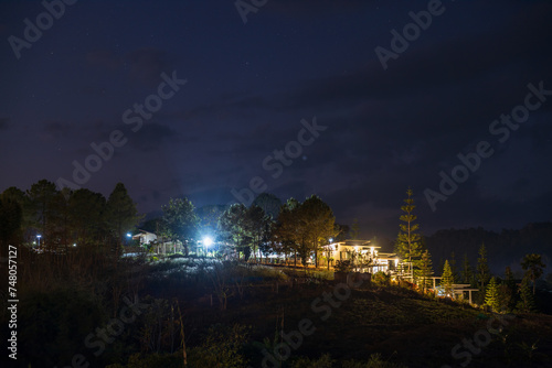 The view of twinkling lights from the many residential houses nestled on hills.
