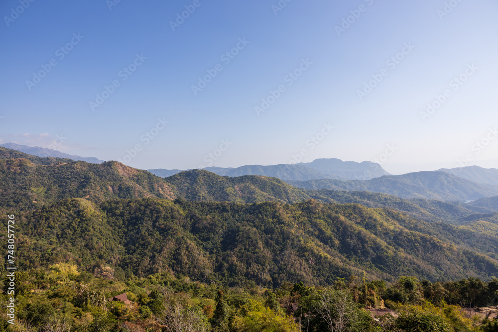The scenery of many mountain hills overlapping one another.