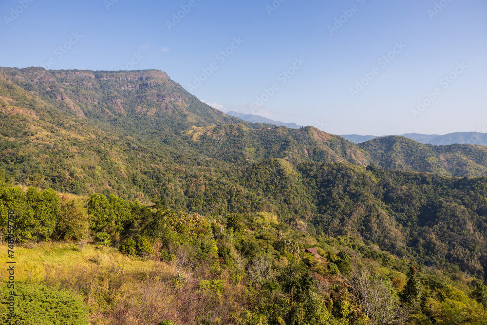 The scenery of many mountain hills overlapping one another.