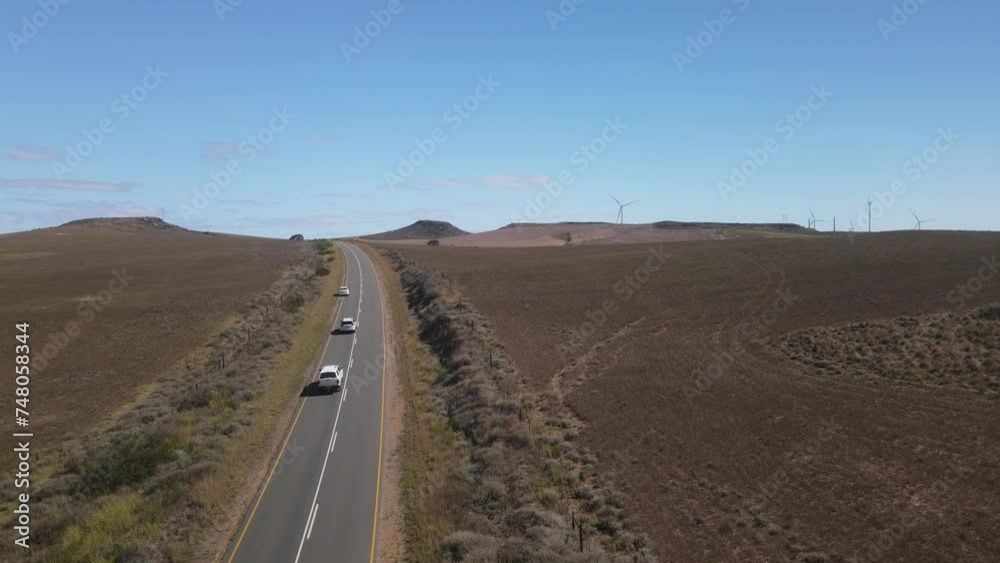 Fly over across South African straight desert road with blue sky background Fly over across South African straight desert road with blue sky background