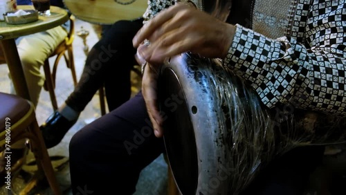 Hands of man playing darbuka. Man plays egyptian tabla drum. Chalice drum hand percussion photo