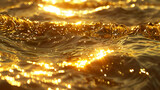 Waves on the seashore illuminated by the golden light of the morning sun