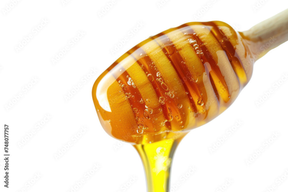 Honey dripping from honey dipper isolated on transparent background. Honey dripping from honey dipper isolated on transparent background.