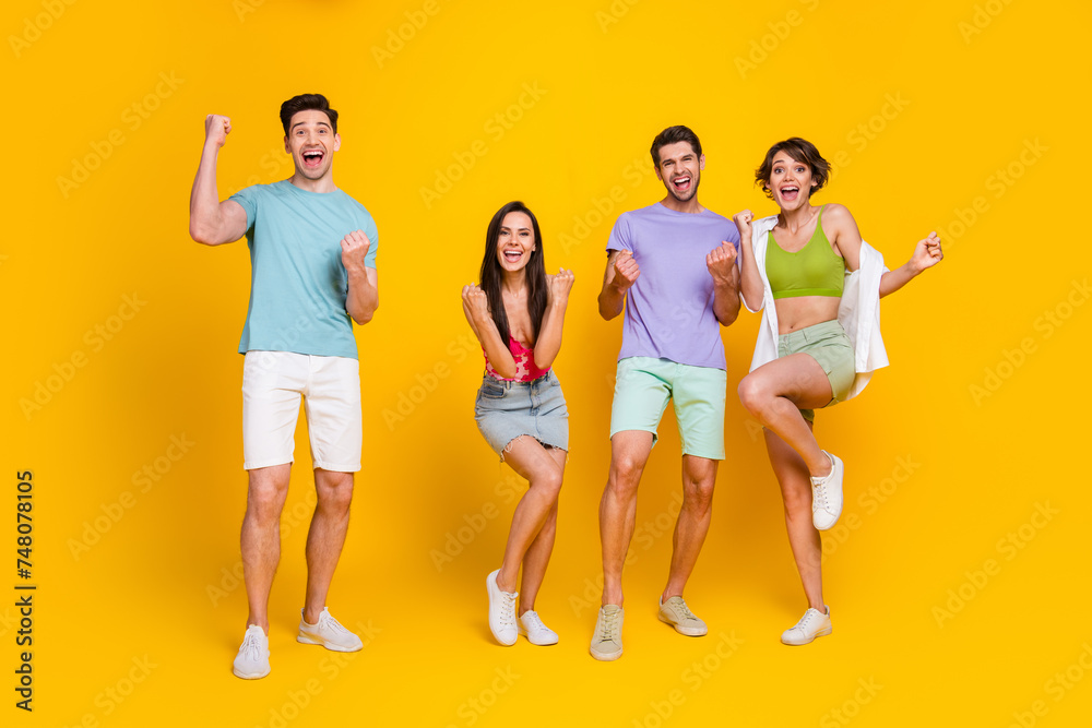 Obraz premium photo of crazy positive cheerful youngster winning raise fists up isolated bright color background