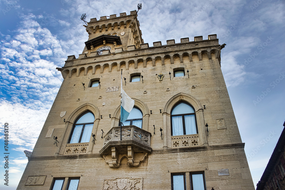 The Government Palace of the Republic of San Marino with the flag of San Marino flying from the balcony in the central square of the city