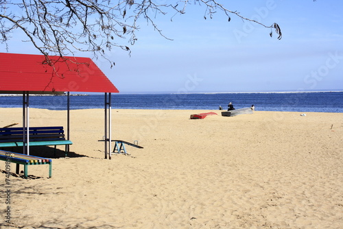 Red canopy on the beach with the Sea of Azov in the background photo