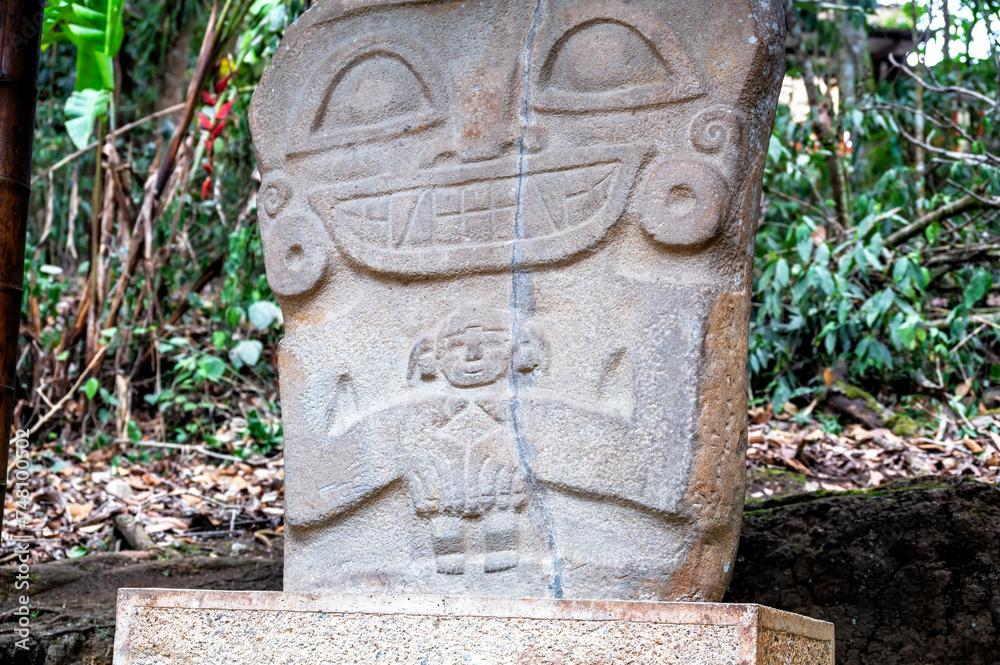 Ancient statue holding a baby in San Agustin, Colombia