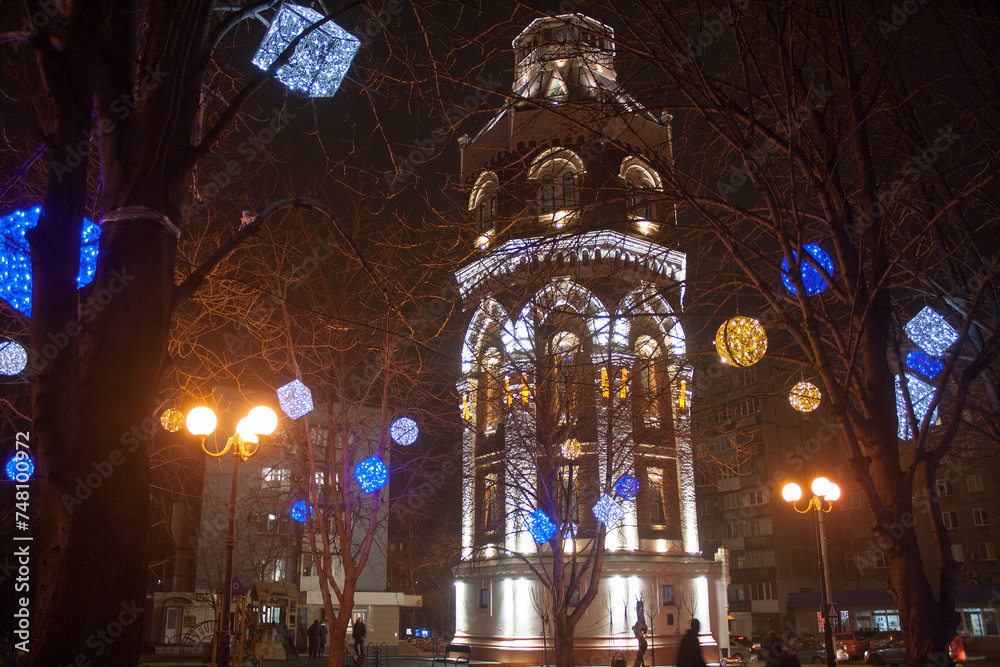 Mariupol. Donbass. Old water tower illuminated at night.