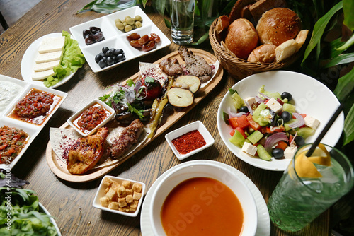 Wooden Table With Plates of Food