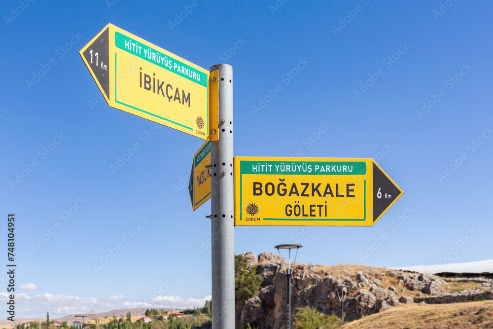 Fototapeta premium Road sign at Bogazkale near ruins of ancient city of Hattusa. Corum, Turkey (Turkiye)
