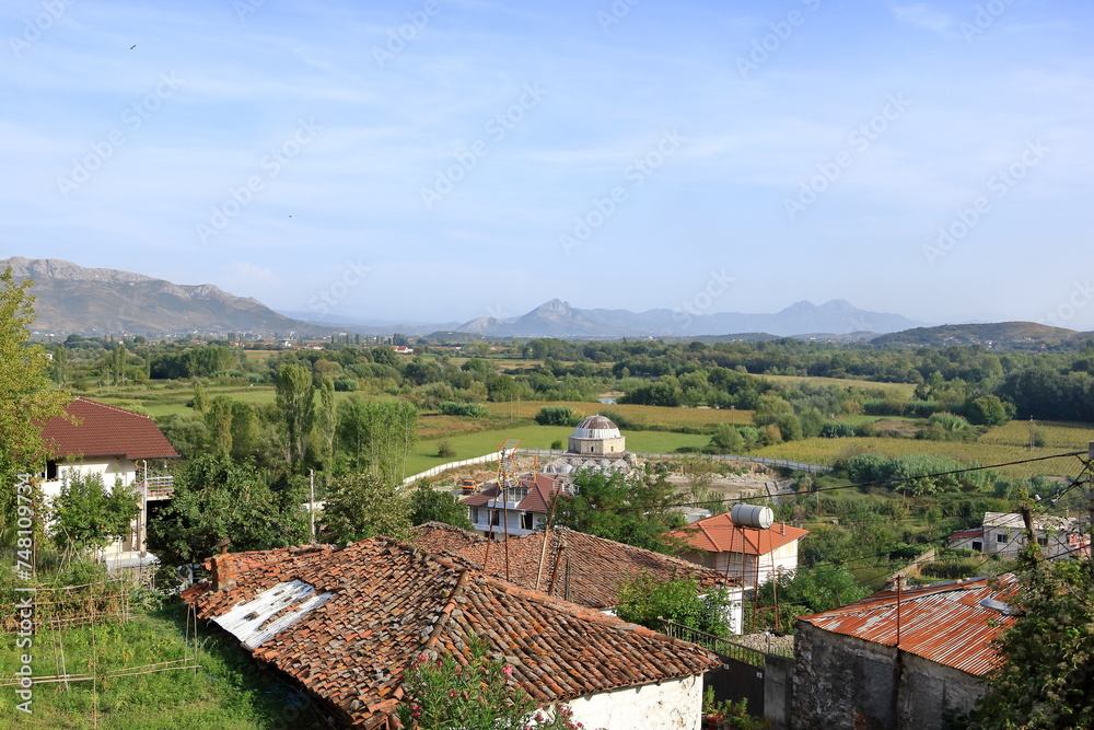 Obraz premium View of a valley with a rural settlement from the ancient stone wall of Rozafa Castle in Shkoder, Albania