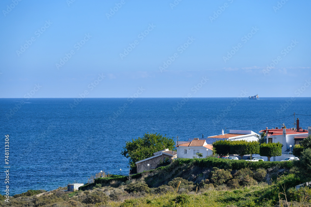 Village houses by the coastline in the Mediterranean Sea, Alicante, Spain