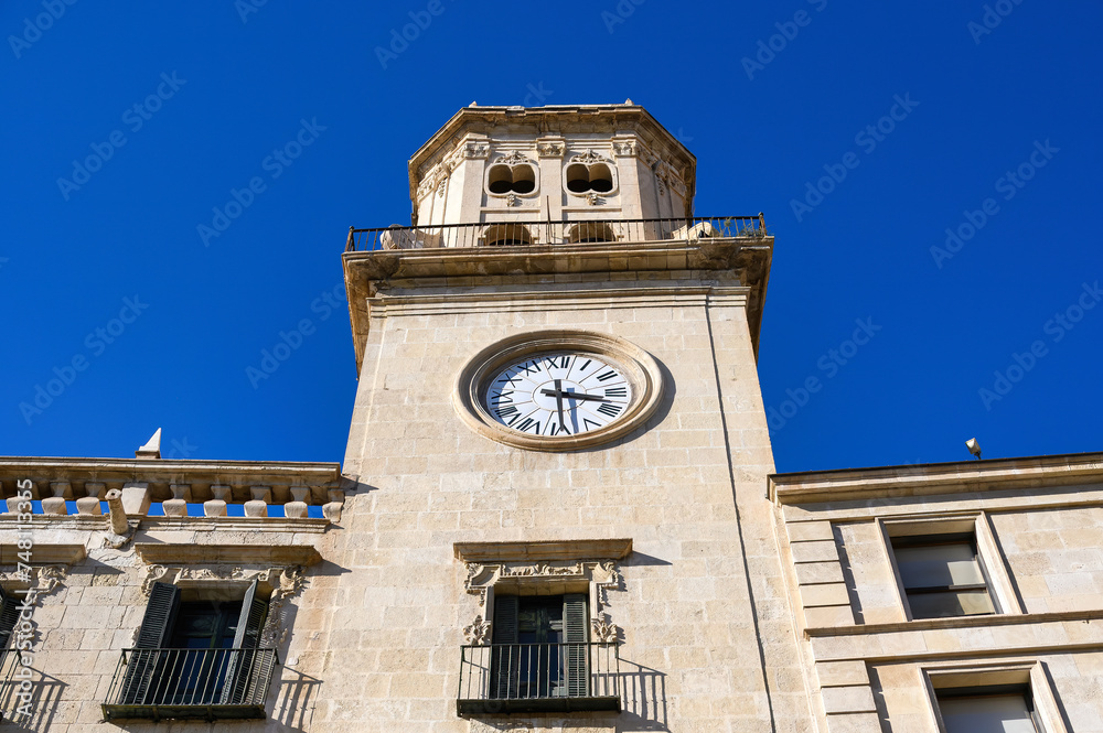 Low angle view of clock tower in medieval facade of the City Hal