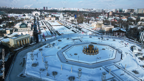 Historic square with fountain in winter. Creative. Top view of beautiful square with fountain on sunny winter day. Historical square of Soviet city with beautiful architecture in winter