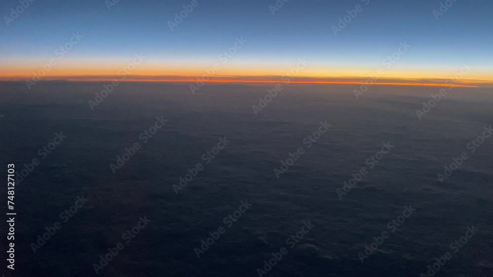 View from the airplane window to the clouds and beautiful sky View from the airplane window to the clouds and beautiful sky