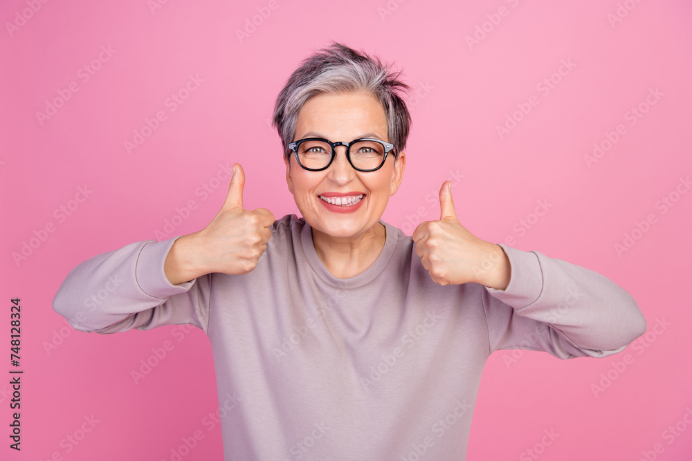 Photo of glad cheerful lovely woman dressed stylish outfit two hans thumbs up nice offer good job isolated on pink color background Photo of glad cheerful lovely woman dressed stylish outfit two hans thumbs up nice offer good job isolated on pink color background