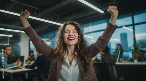 Capture the exuberance of a happy young businesswoman in a dynamic startup office, embodying the essence of a successful professional. 