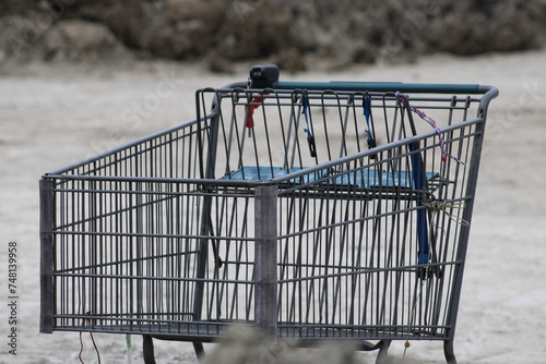 A shopping cart abandoned on the "highway to heaven" as some have called the dirt pile from the redo and upgrades to the I-635 Expressway, Dallas. homeless encampment, 