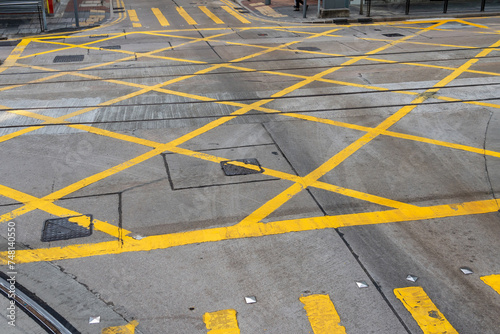 Road asphalt hatches intersection lines yellow pedestrian crossings in the city.