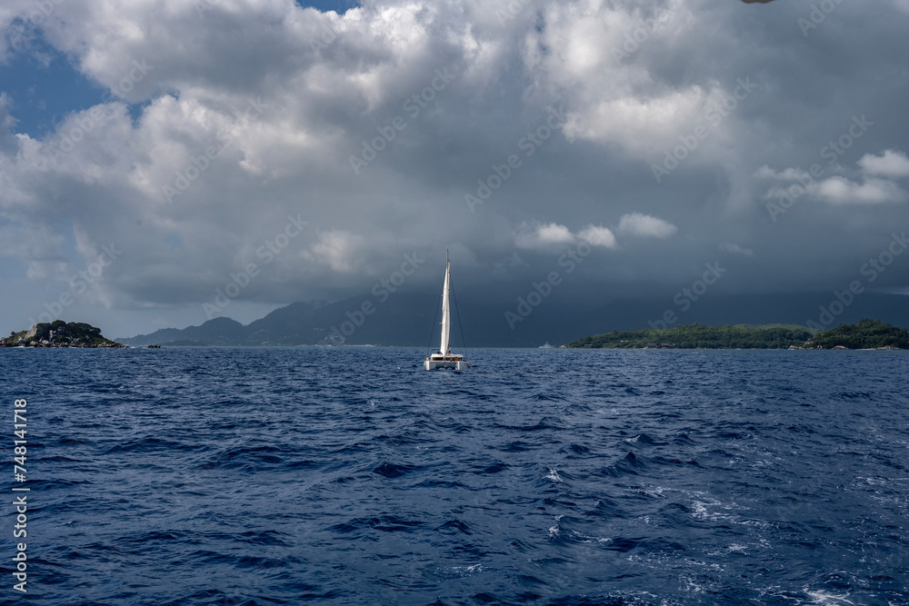 Fototapeta premium sea ships on the blue sea on a sunny day near the Seychelles