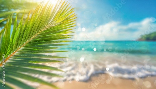 Blur beautiful nature green palm leaf on tropical beach with bokeh sun light wave abstract background. Copy space of summer vacation and business travel concept.