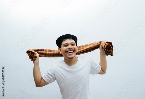 asian man with saroong showing happy expression photo